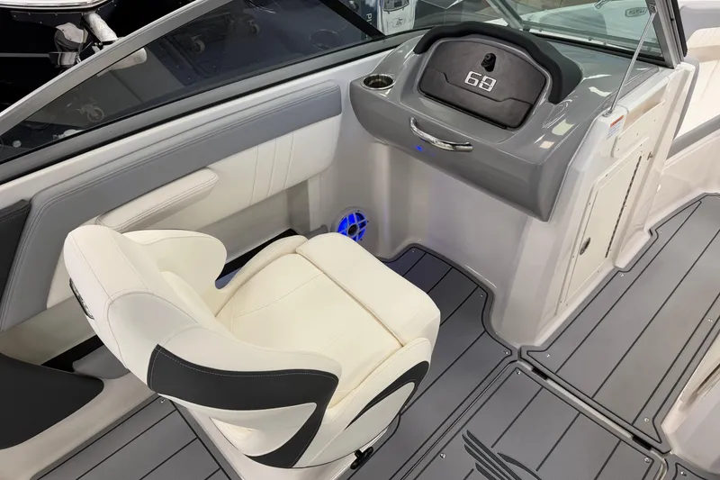 Slide: The Image of 2025 Chaparral 21 SSi OB boat interior with sleek dashboard and comfortable seating. - 15