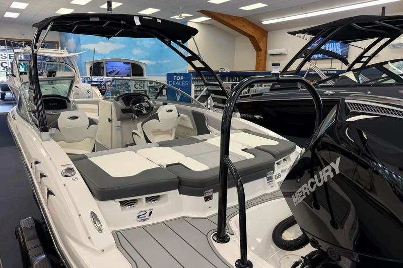 Slide: The Image of 2025 Chaparral 21 SSi OB boat with Mercury engine in showroom display. - 3