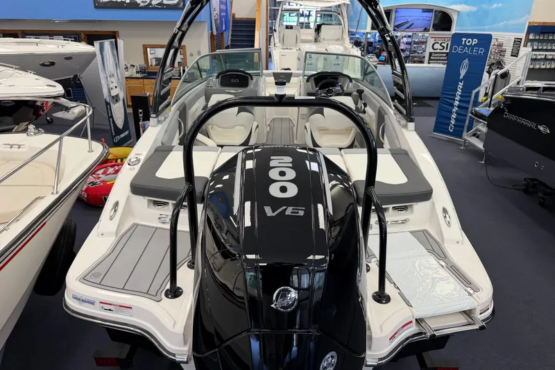 Slide: The Image of 2025 Chaparral 21 SSi OB boat with 200 V6 engine displayed in showroom. - 4