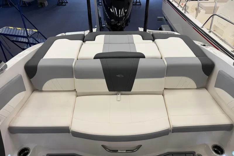 Slide: The Image of 2025 Chaparral 21 SSi OB boat interior with cushioned seating and modern design. - 7
