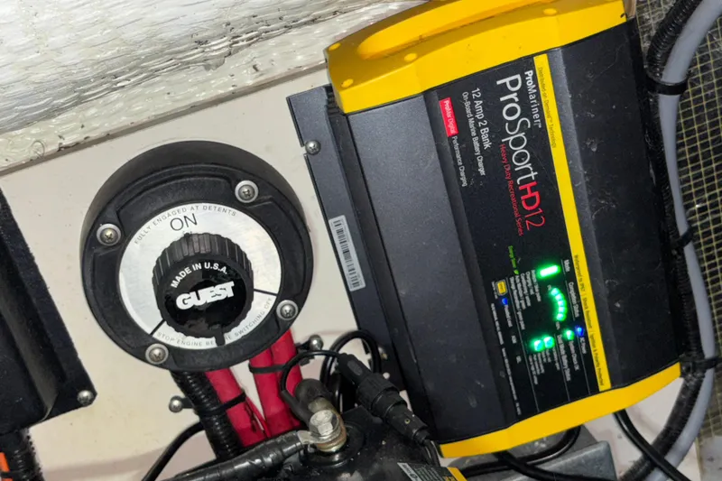 Slide: The Image of Battery switch and ProSport HD12 charger on a 1995 Luhrs 29 Open boat. - 13