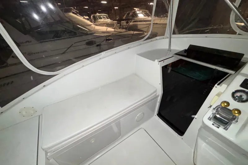 Slide: The Image of 1995 Luhrs 29 Open boat interior with helm, controls, and seating area. - 17