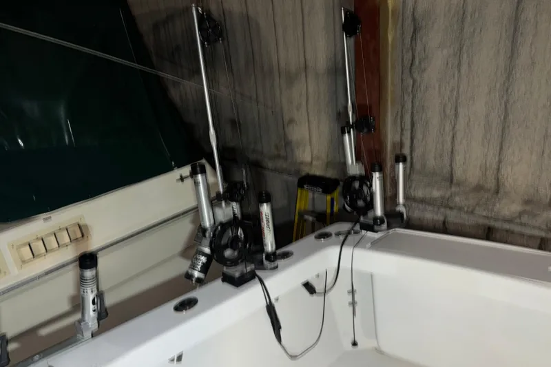 Slide: The Image of 1995 Luhrs 29 Open boat interior with fishing rod holders and equipment. - 18