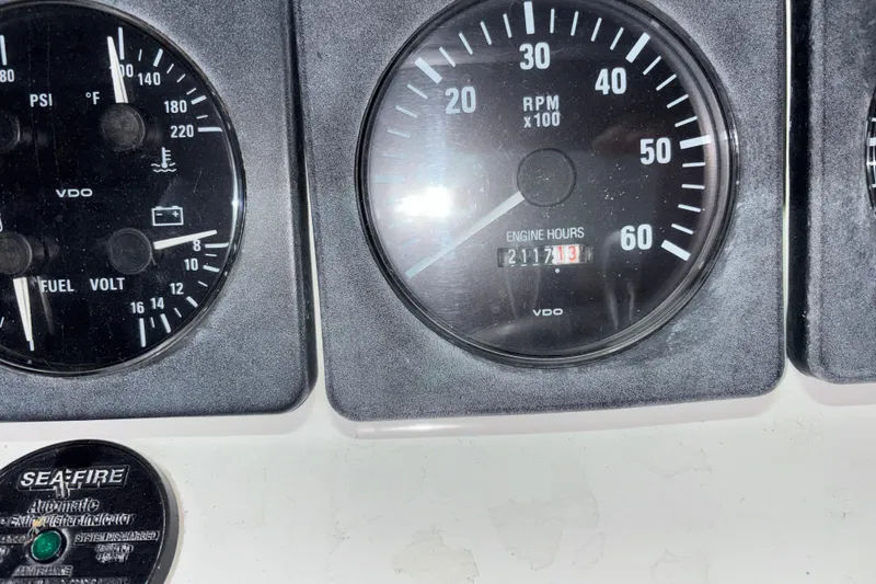 Slide: The Image of Close-up of 1995 Luhrs 29 Open boat gauges showing RPM and engine hours. - 20