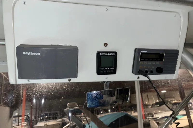 Slide: The Image of Control panel of a 1995 Luhrs 29 Open boat with Raytheon electronics. - 24