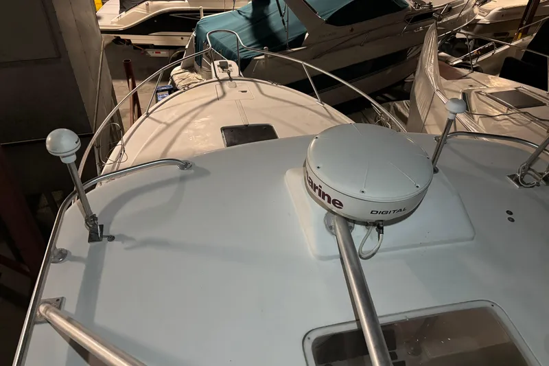 Slide: The Image of 1995 Luhrs 29 Open boat deck with marine equipment in storage. - 38
