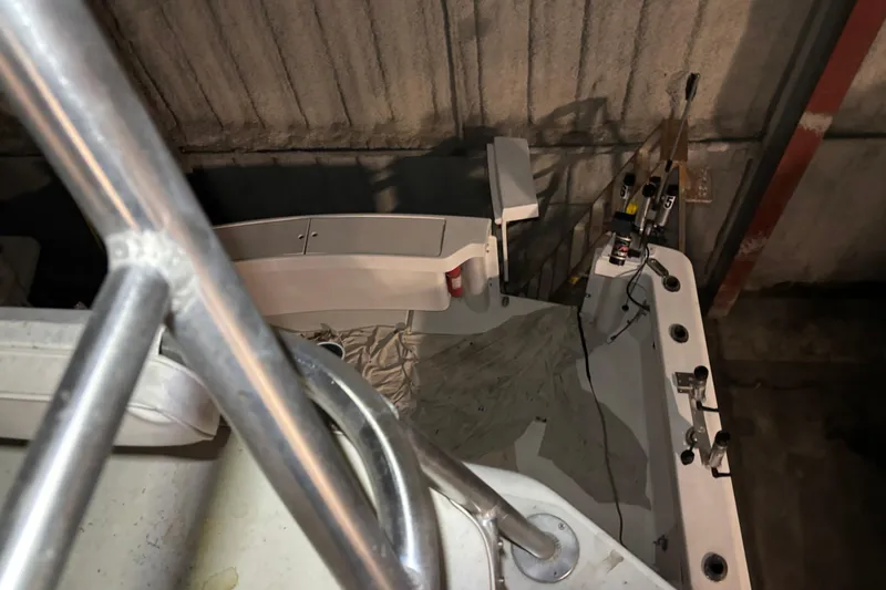 Slide: The Image of 1995 Luhrs 29 Open boat interior with fishing rod holders and equipment. - 39