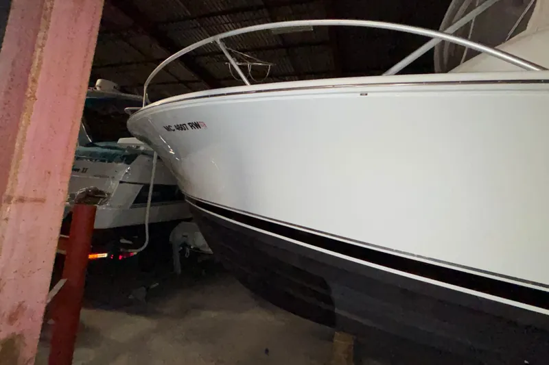 Slide: The Image of 1995 Luhrs 29 Open boat stored indoors, side view. - 6