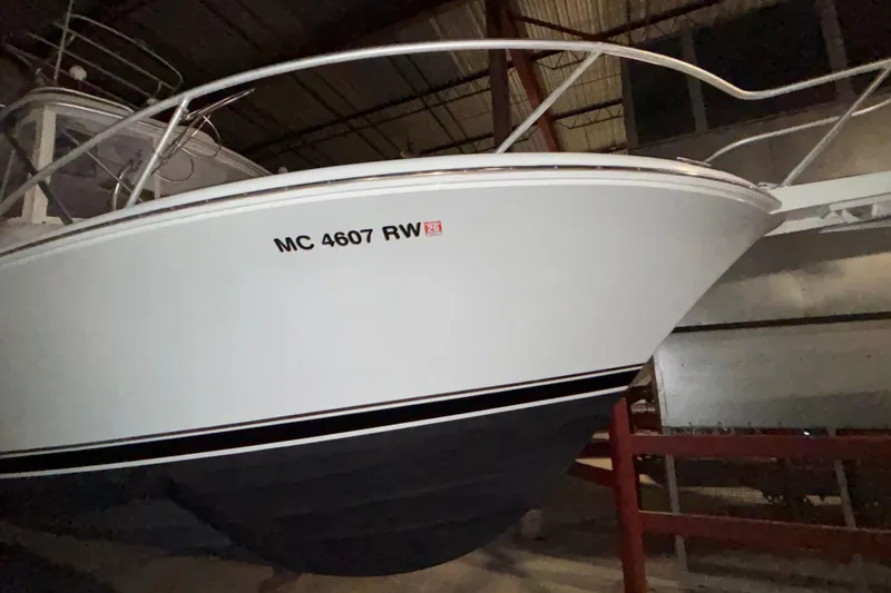 Slide: The Image of 1995 Luhrs 29 Open boat in storage, displaying registration number MC 4607 RW. - 7