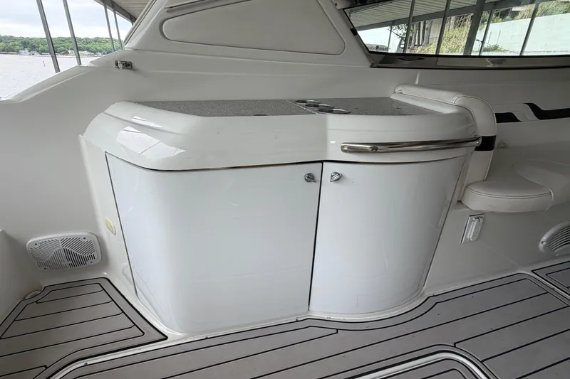 Slide: The Image of 2005 Formula 330 Sun Sport boat interior with sleek white cabinetry and seating. - 10