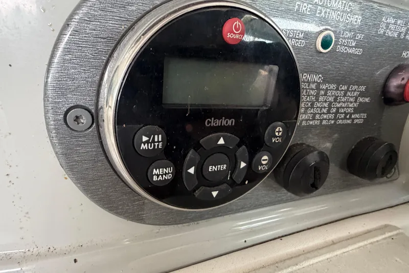Slide: The Image of Control panel of a 2005 Formula 330 Sun Sport boat with Clarion audio system. - 16