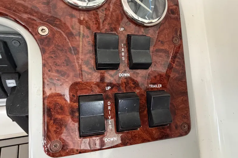 Slide: The Image of Control panel of a 2005 Formula 330 Sun Sport boat with switches and gauges. - 19