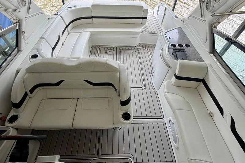 Slide: The Image of 2005 Formula 330 Sun Sport boat interior with white seating and sleek design. - 20