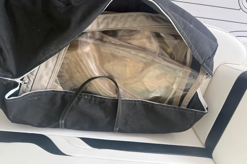 Slide: The Image of Black bag with clear plastic panels on a Formula 330 Sun Sport boat seat. - 21