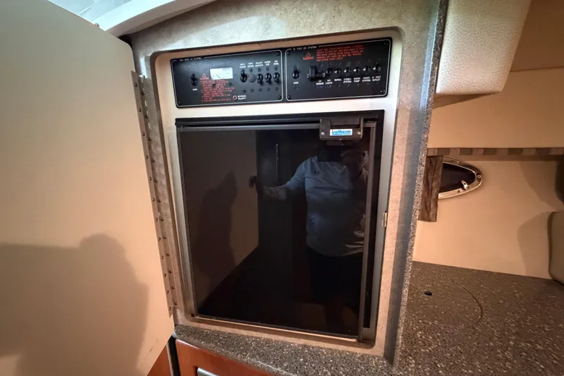 Slide: The Image of Built-in refrigerator in 2005 Formula 330 Sun Sport boat interior. - 25
