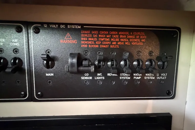 Slide: The Image of Control panel of a 2005 Formula 330 Sun Sport boat's 12-volt DC system. - 26