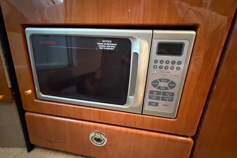 Slide: The Image of Built-in Tappan microwave in 2005 Formula 330 Sun Sport boat interior. - 28