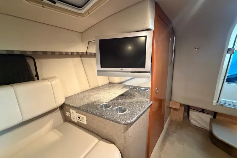 Slide: The Image of Interior of 2005 Formula 330 Sun Sport boat with TV and seating area. - 29