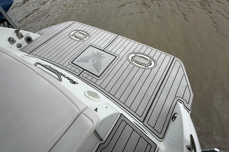 Slide: The Image of 2005 Formula 330 Sun Sport boat deck with custom non-slip surface by the water. - 3
