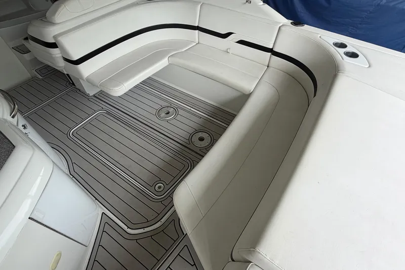 Slide: The Image of 2005 Formula 330 Sun Sport boat interior with white seating and patterned flooring. - 8