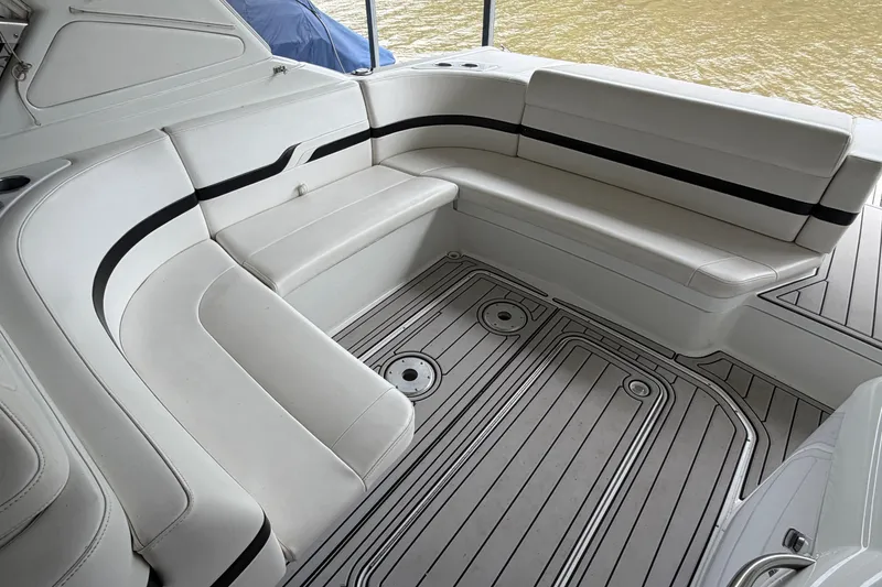 Slide: The Image of 2005 Formula 330 Sun Sport boat interior with white seating and sleek design. - 9