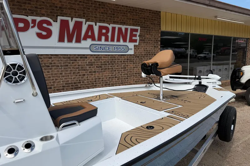 Slide: The Image of 2026 Xpress H20B Bay boat displayed at a marine dealership. - 3