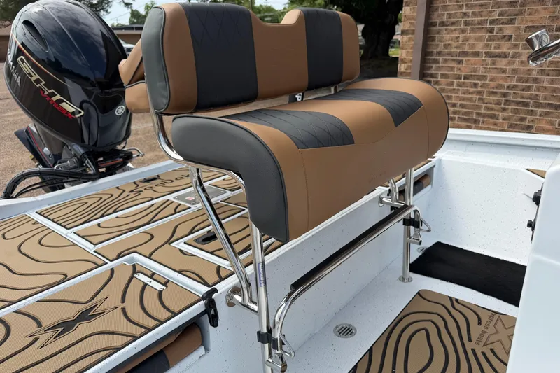 Slide: The Image of 2026 Xpress H20B Bay boat interior with cushioned seating and Yamaha outboard motor. - 6