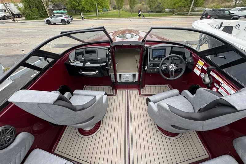 Slide: The Image of Interior of 2026 Stingray 23 OCX boat with modern dashboard and seating. - 12