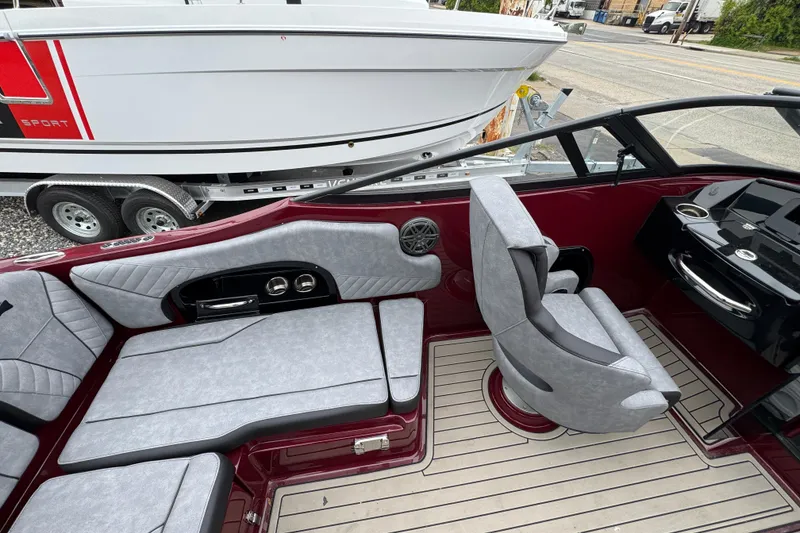 Slide: The Image of Interior of 2026 Stingray 23 OCX boat with modern seating and sleek design. - 13