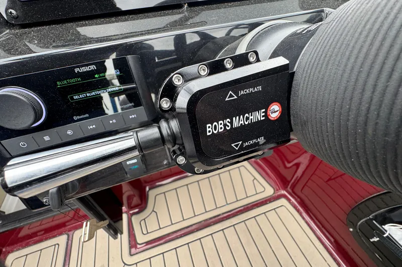 Slide: The Image of Control panel of 2026 Stingray 23 OCX boat with Bluetooth and jackplate controls. - 19
