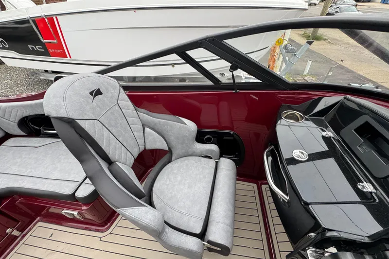 Slide: The Image of Interior of 2026 Stingray 23 OCX boat with sleek seating and modern dashboard design. - 22