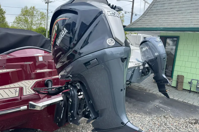 Slide: The Image of 2026 Stingray 23 OCX boat with Yamaha outboard motors displayed outdoors. - 3