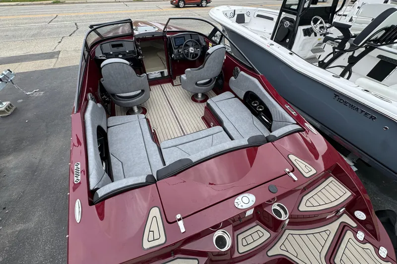 Slide: The Image of 2026 Stingray 23 OCX boat with sleek red design and modern interior seating. - 35