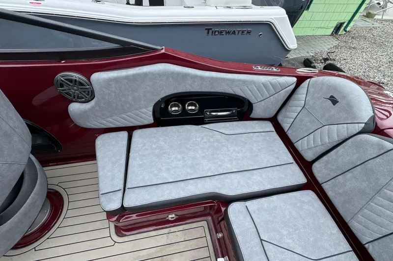 Slide: The Image of Interior of 2026 Stingray 23 OCX boat with gray seating and cup holders. - 9