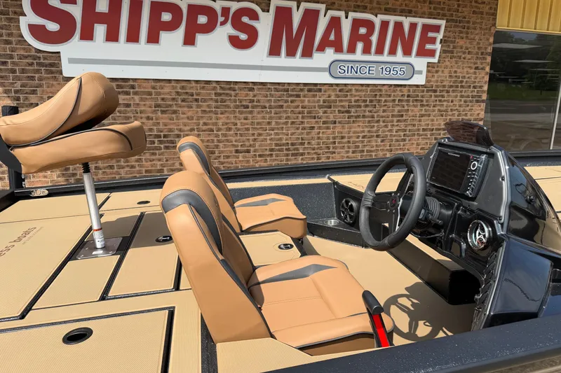 Slide: The Image of Interior of 2026 Xpress H20 boat with tan seats at Shipp's Marine. - 3