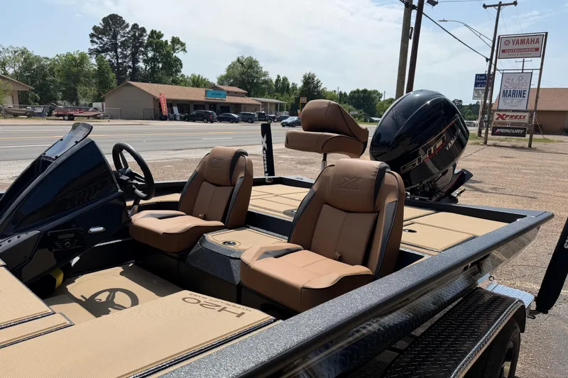 Slide: The Image of 2026 Xpress H20 boat with Yamaha engine, featuring tan seats and sleek design. - 5