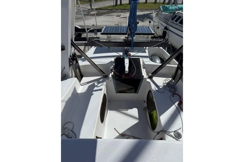 Slide: The Image of 1990 Corsair F 27 sailboat cockpit with ropes and solar panel. - 13