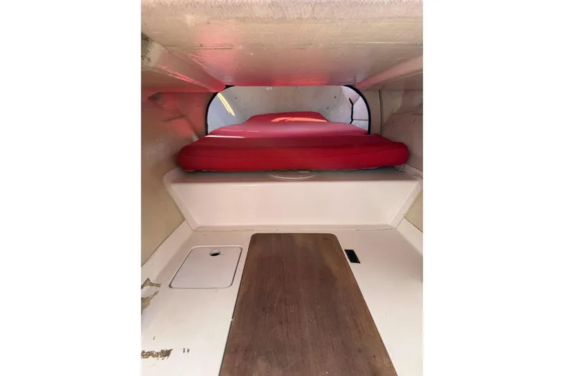 Slide: The Image of Interior cabin of a 1990 Corsair F 27 sailboat with red cushions. - 5