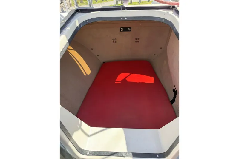 Slide: The Image of Interior cabin of 1990 Corsair F 27 sailboat with red cushion. - 6