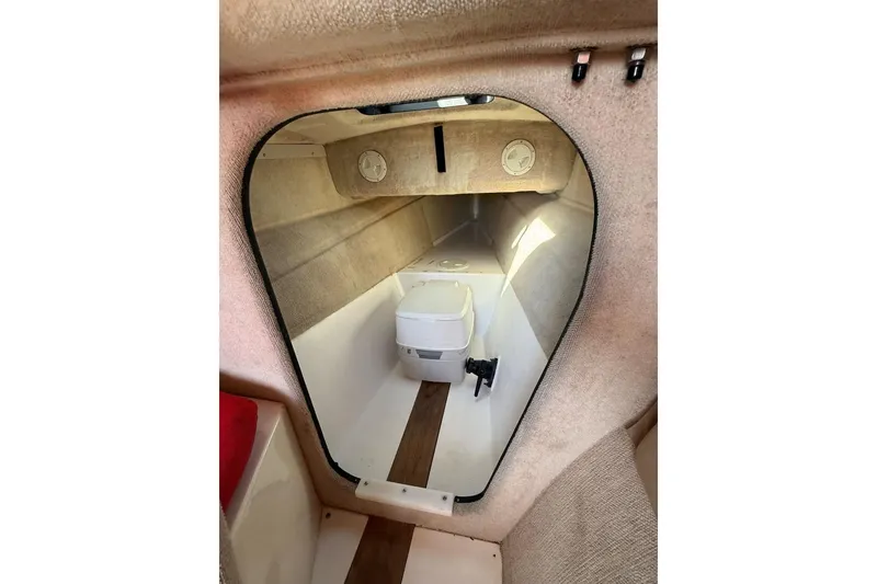 Slide: The Image of Interior of a 1990 Corsair F 27 sailboat cabin with compact toilet. - 7