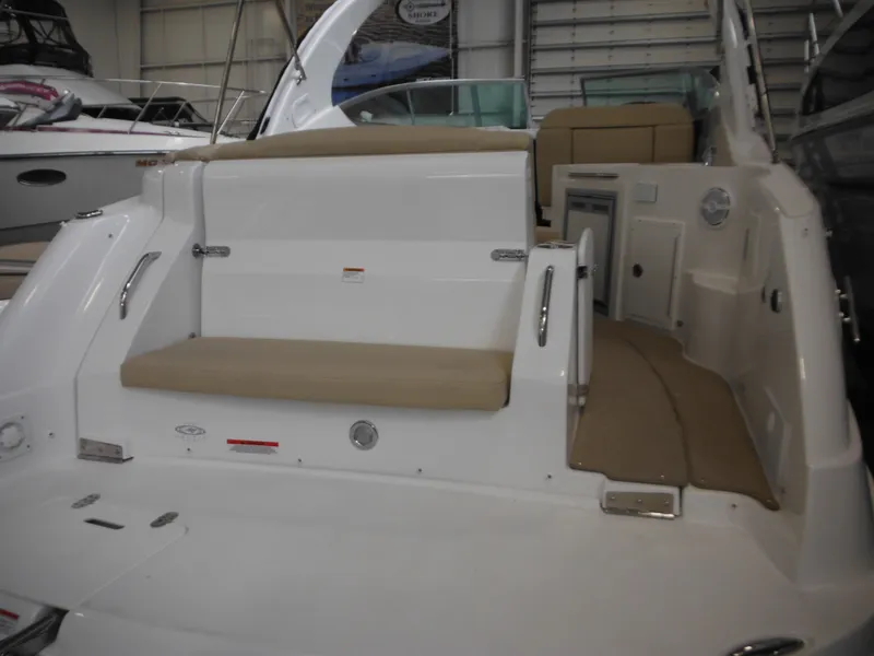 Slide: The Image of 2014 Rinker 290 Express Cruiser, interior view of rear seating area. - 16