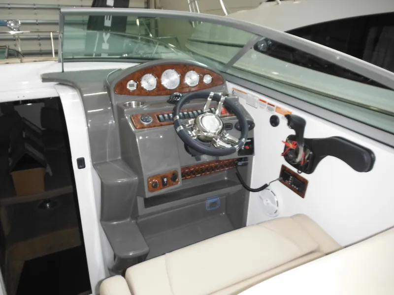 Slide: The Image of Interior view of 2014 Rinker 290 Express Cruiser cockpit. - 18