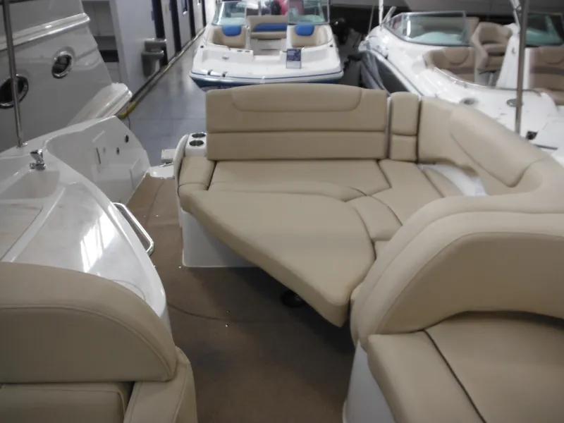 Slide: The Image of Interior of 2014 Rinker 290 Express Cruiser with beige seating. - 19