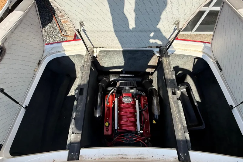 Slide: The Image of 2005 MasterCraft XStar engine compartment with open hatches, showcasing the MCX engine. - 19