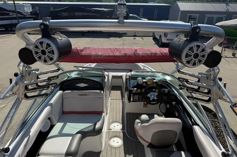 Slide: The Image of 2005 MasterCraft XStar boat interior with speakers and wakeboard racks. - 24
