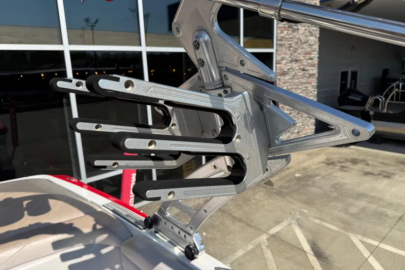 Slide: The Image of Wakeboard rack on a 2005 MasterCraft XStar boat, featuring sleek metal design. - 26