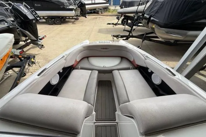 Slide: The Image of 2005 MasterCraft XStar boat interior with spacious seating and sleek design. - 3