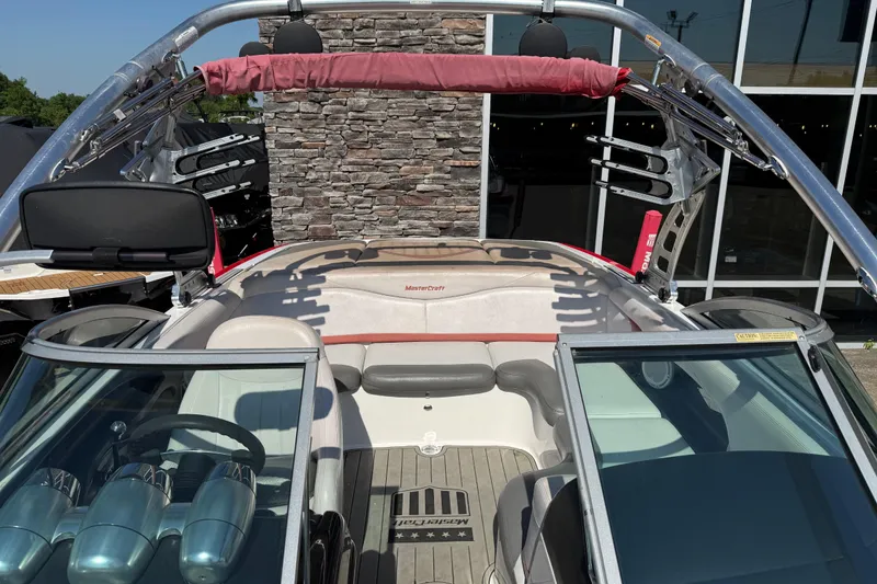 Slide: The Image of 2005 MasterCraft XStar boat interior with seating and wakeboard tower. - 9