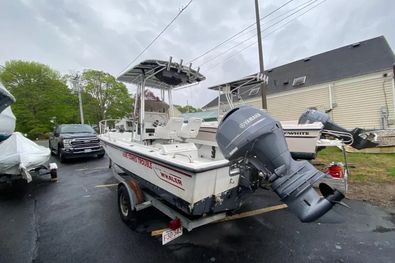 Slide: The Image of 1994 Boston Whaler 19 Outrage boat with Yamaha outboard motor on trailer. - 3