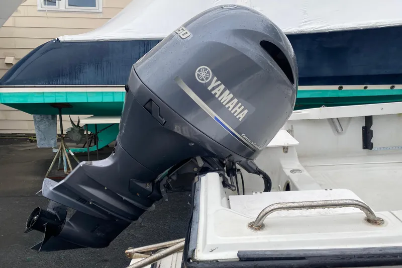 Slide: The Image of Yamaha outboard motor on a 1994 Boston Whaler 19 Outrage boat. - 6